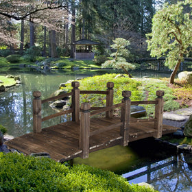 RELIANCER wooden garden bridge arch shows carbonized finish for durability.
