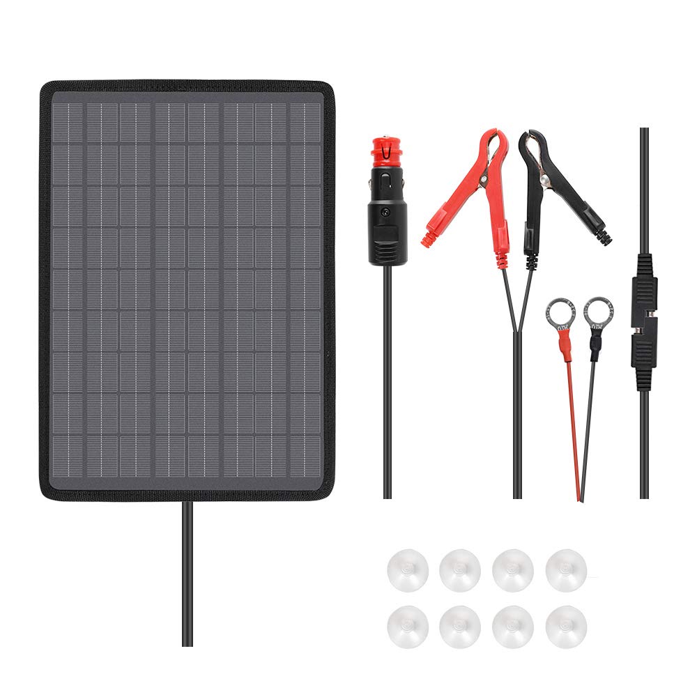 Renogy 10W solar trickle charger with suction mount on windshield for easy charging.