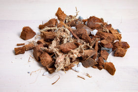 rePotme orchid mix close-up highlights drainage-focused media for roots.