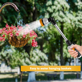 Restmo metal watering wand in-use over hanging baskets provides gentle irrigation for blooms.