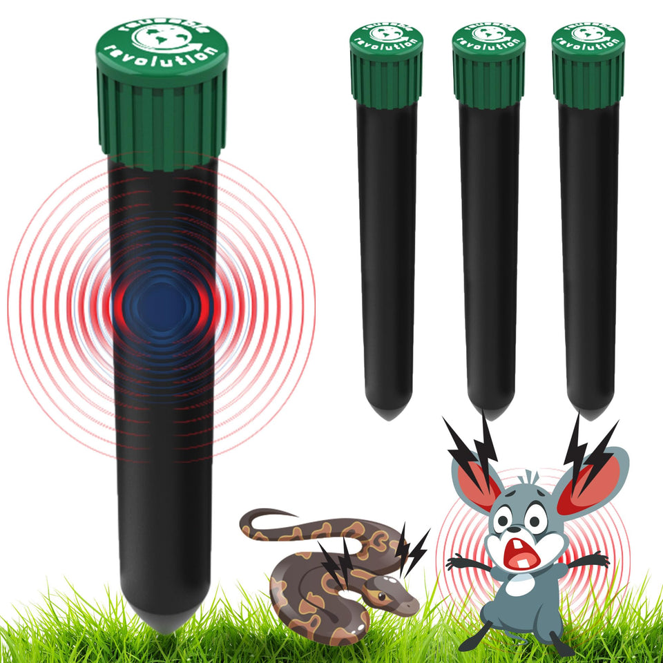 Reusable Revolution Mole Chaser stakes lined up along a yard to deter pests.