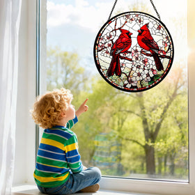 Riletese cardinal stained-glass sun catcher on a window for bright interior color