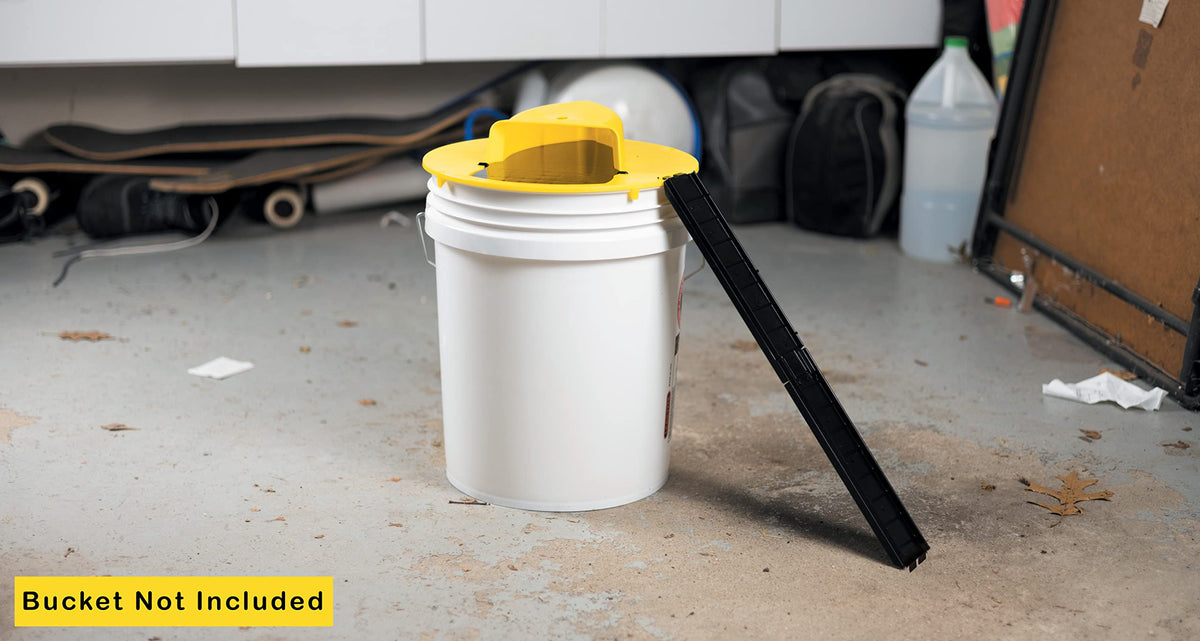 RinneTraps Flip N Slide in the garage shows versatile placement for pest control.
