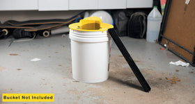 RinneTraps Flip N Slide in the garage shows versatile placement for pest control.