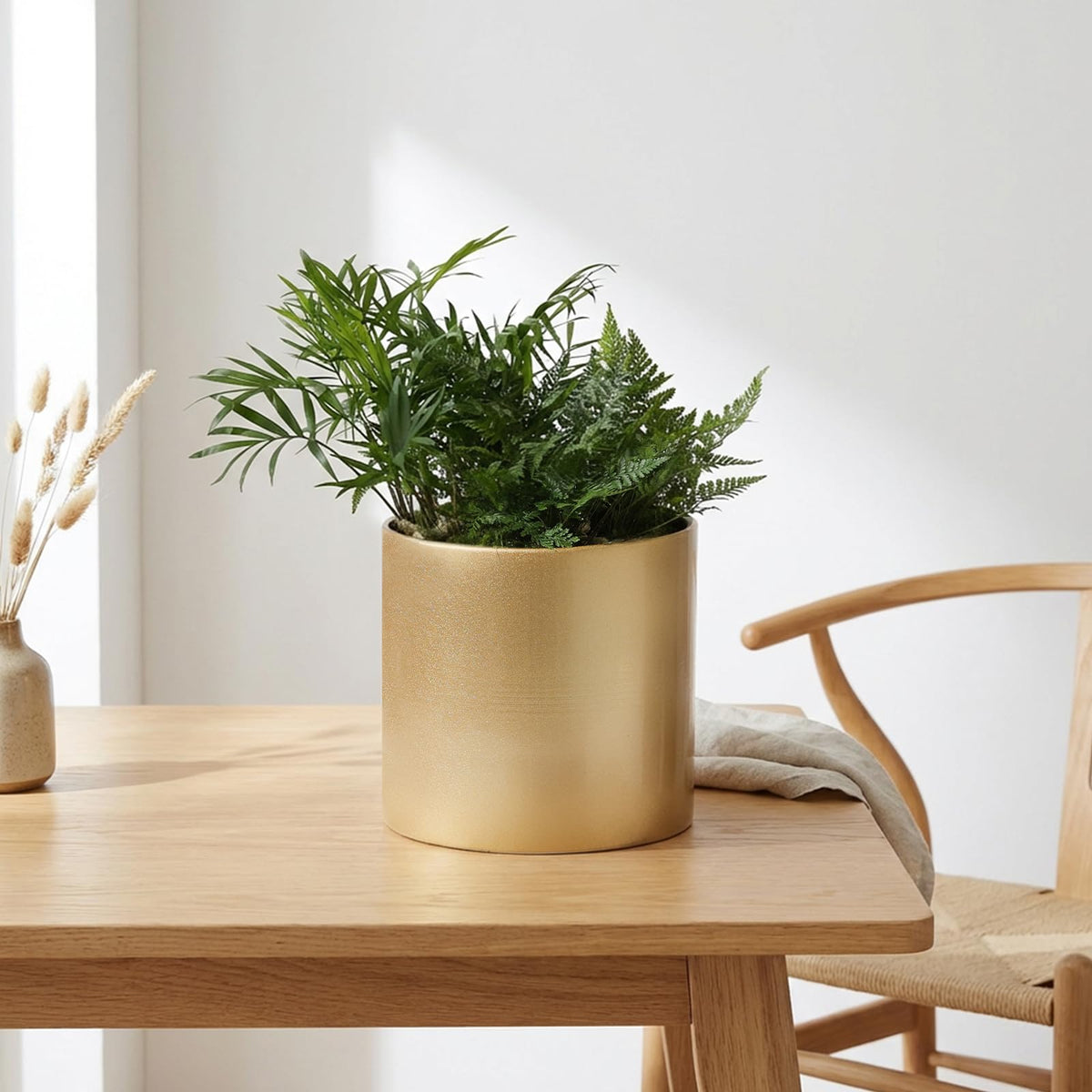 Rioneta gold metal pot with drainage hole keeps soil well-drained