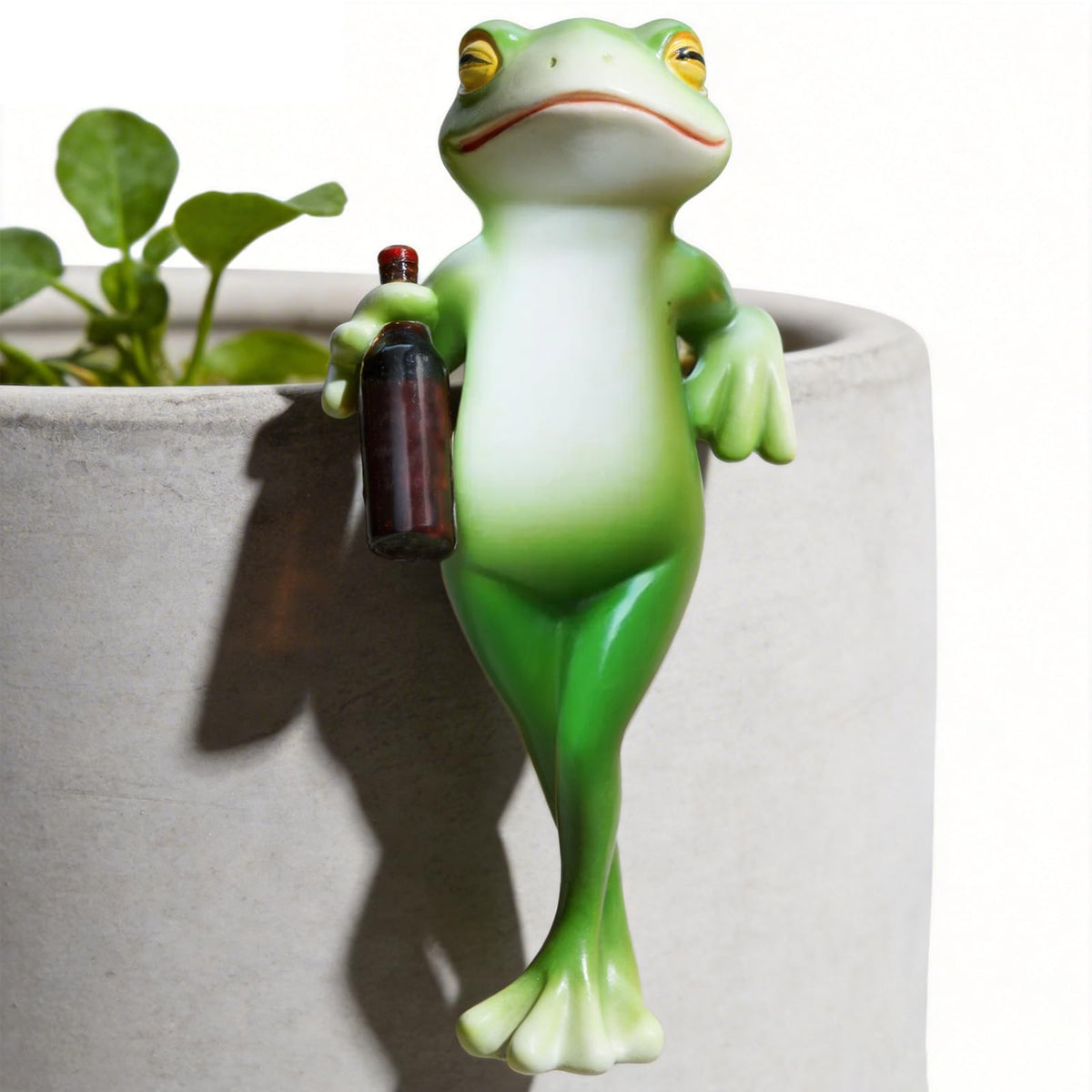 RJVZUKL Tipsy Frog Pot Hugger clings to planters for whimsical outdoor decor