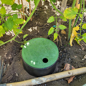 Rocky Mountain Goods green cover lid blends with lawn while giving easy access.