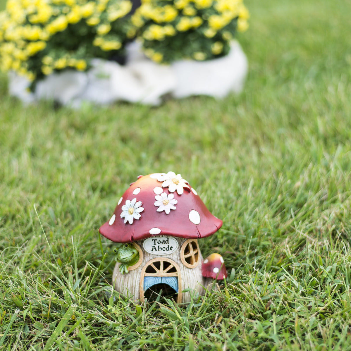 Roman Inc mushroom and flowers statue adds whimsy to garden pathways
