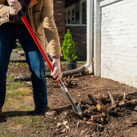 Root Slayer fiberglass shaft provides stable control during soil cutting.