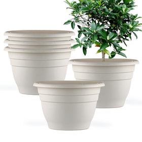 RooTrimmer 10-inch round white plant pot with drainage holes for indoor or outdoor use.