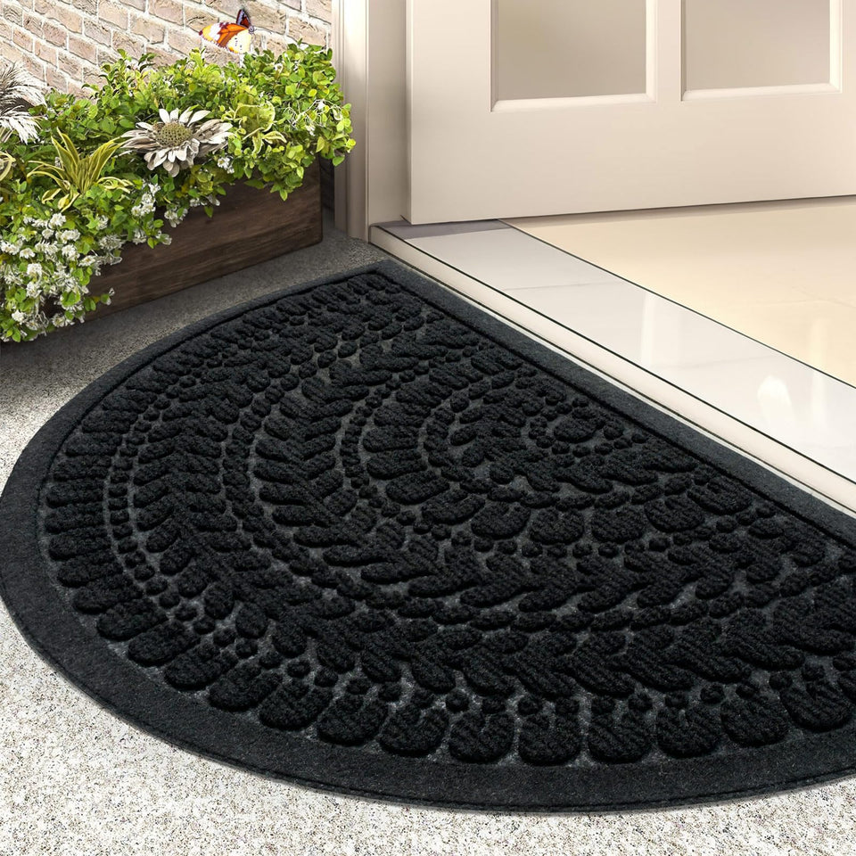 RORA half-circle door mat in black at entry, traps dirt and moisture.