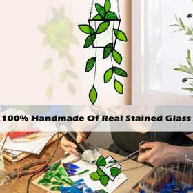 Royxen sunlit-glass-suncatcher reflects shifting greens in daylight.