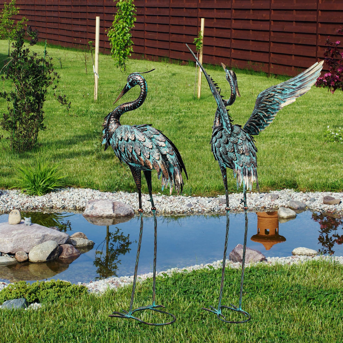 Ruifabo cranes by a pond or patio elevate water-edge spaces