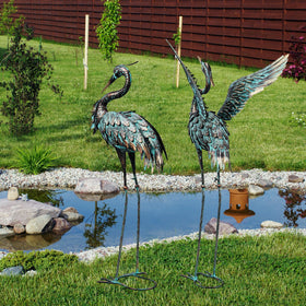 Ruifabo cranes by a pond or patio elevate water-edge spaces