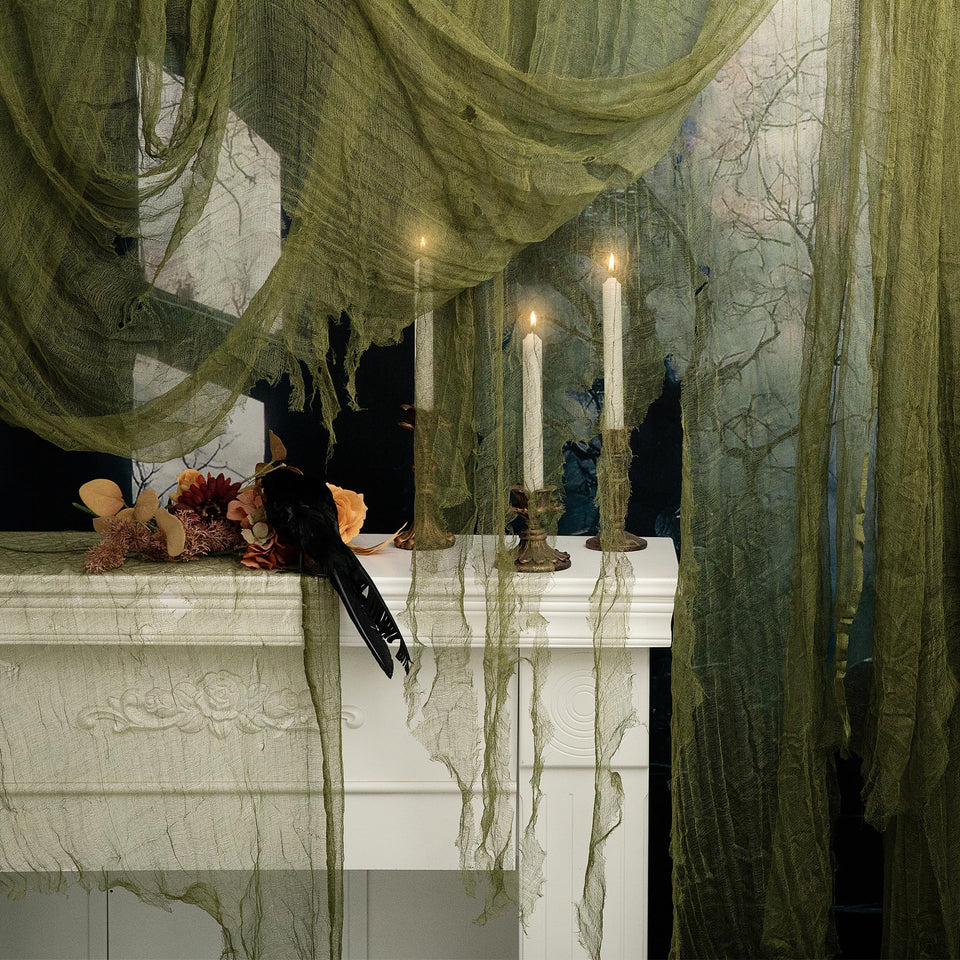 RunNico green cheesecloth rolled for quick Halloween setup and dramatic doorway effects.