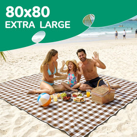 RYCHIC blanket laid on sand showing sandproof surface