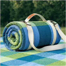RYCHIC waterproof picnic blanket on grass offering durable protection for outdoor picnics.