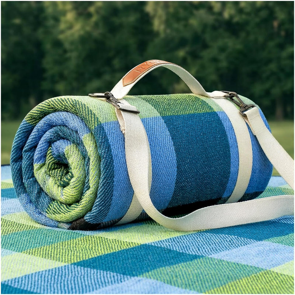 RYCHIC waterproof picnic blanket on grass offering durable protection for outdoor picnics.