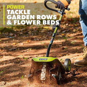 RYOBI Expand-It tiller attachment with 4 steel tines for soil disruption