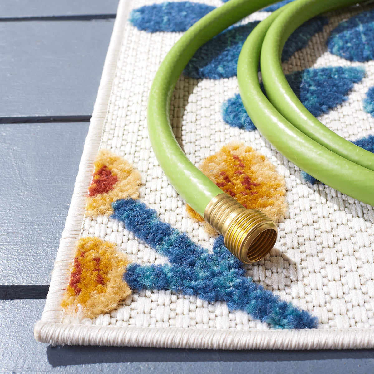 Safavieh Cabana rug with floral cream-red design, ideal for patios and sunrooms.