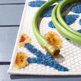 Safavieh Cabana rug with floral cream-red design, ideal for patios and sunrooms.