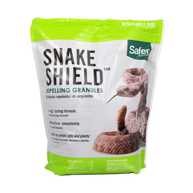 Safer Brand Snake Shield granules applied around a garden perimeter for deterrence