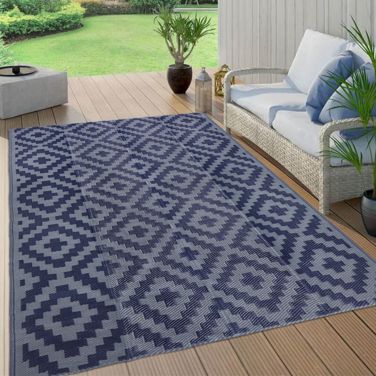 SAND MINE corner loops and stakes secure mat to grass or deck