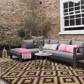 SAND MINE garden rug on a deck, color options Black and Brown.