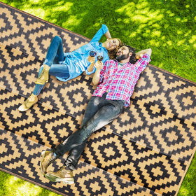 SAND MINE portable rug with carrying bag, ready for picnic or camping.