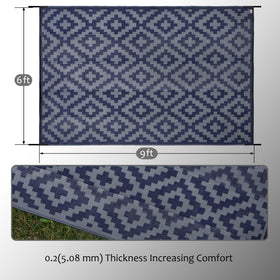 SAND MINE plastic straw rug in an outdoor setting for easy maintenance.