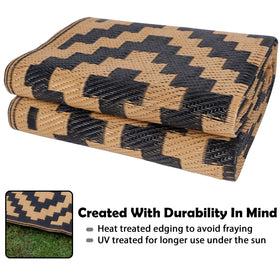 SAND MINE reversible mat outdoors beside a campfire, folds for compact storage.