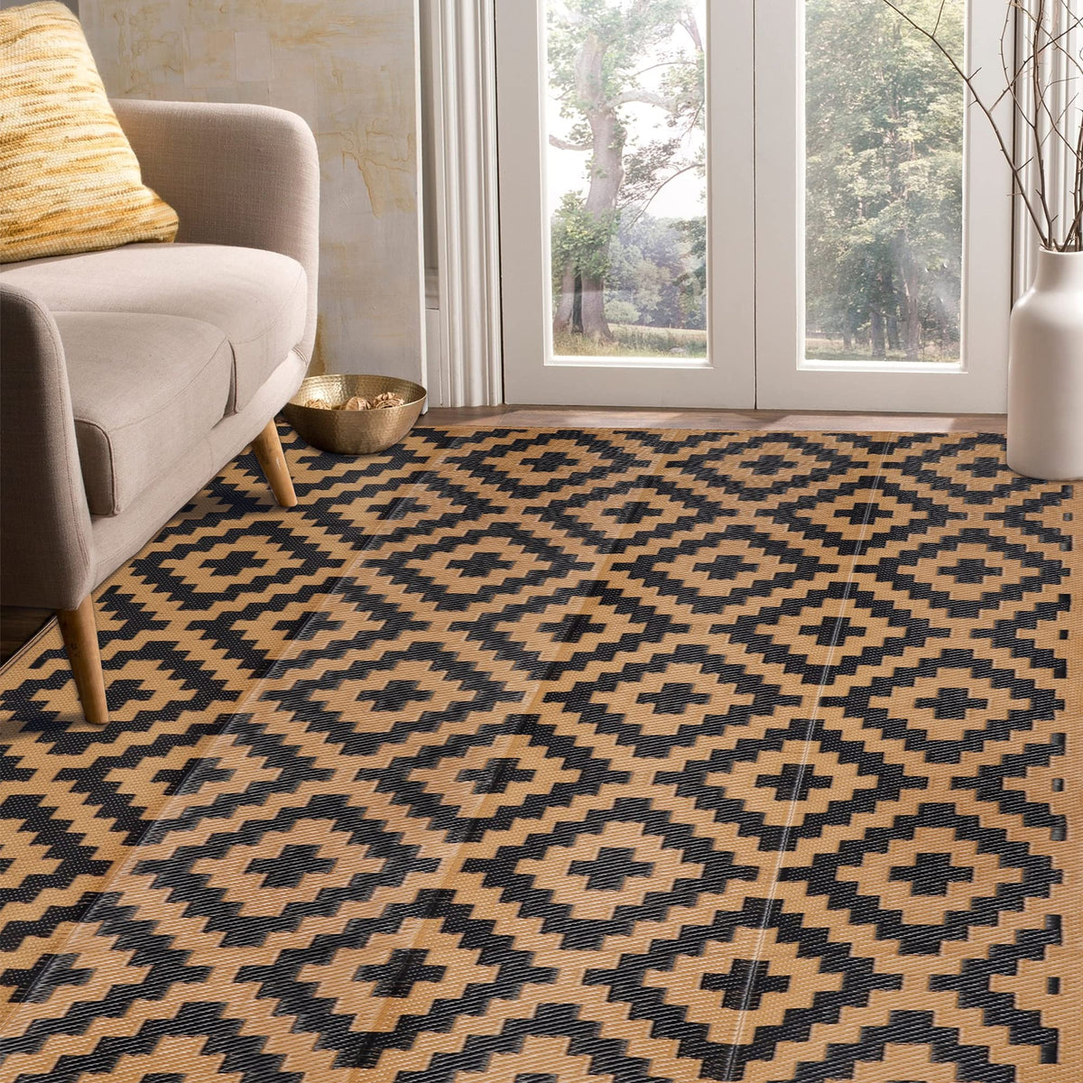 SAND MINE reversible mats on a patio with outdoor furniture, durable and easy to clean.