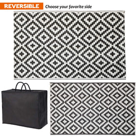 SAND MINE reversible outdoor rug on a deck with seating, adding versatility.