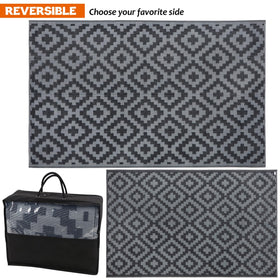 SAND MINE reversible rug rolled for storage showing portable convenience