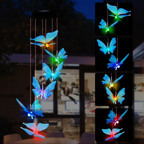 SAND MINE solar wind chime with butterfly design adds magical blue color to outdoor spaces.