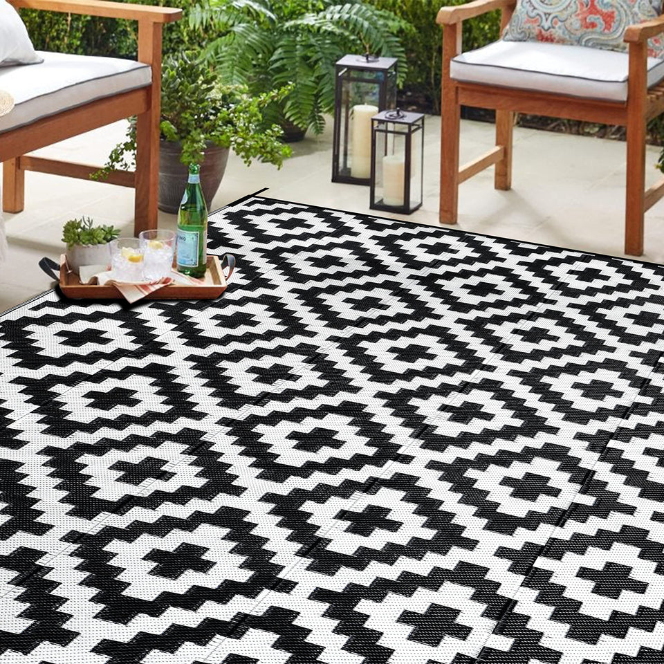 SAND MINE waterproof outdoor rug in black and white lattice for patios and decks.
