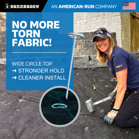 Sandbaggy 6-inch circle-top pins driven into ground on a rocky soil area.