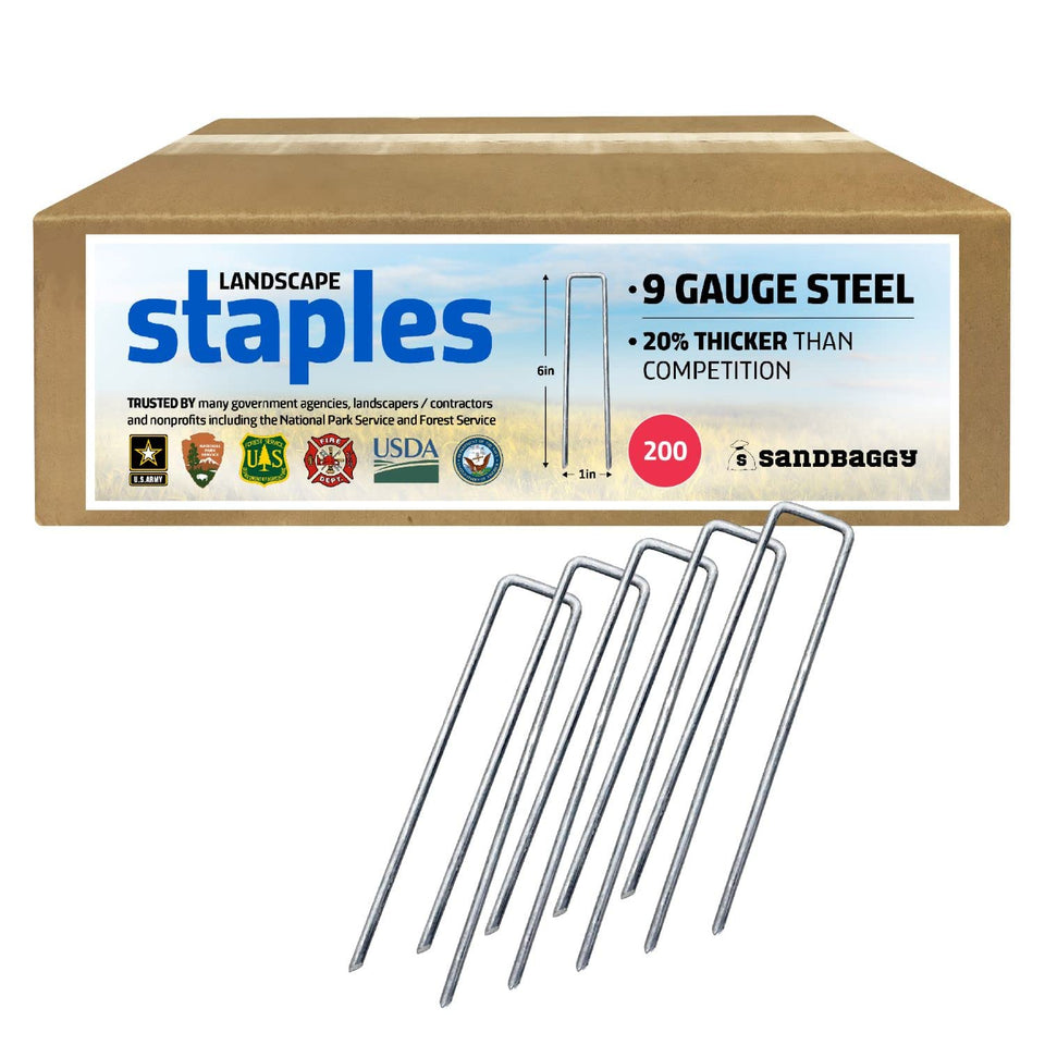 Sandbaggy 6-inch landscape sod staples secure fabric on rocky soil.