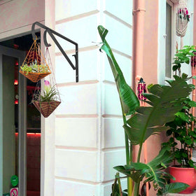 Sanduby lantern-hanger wind-chime setup enhances outdoor space aesthetics.