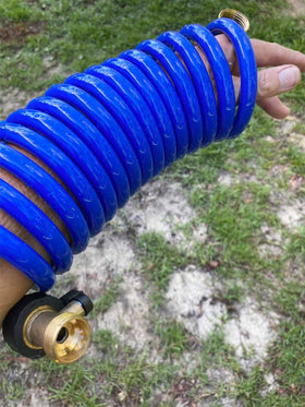 SANFU PU Recoil Hose neatly stored in a tight patio space.