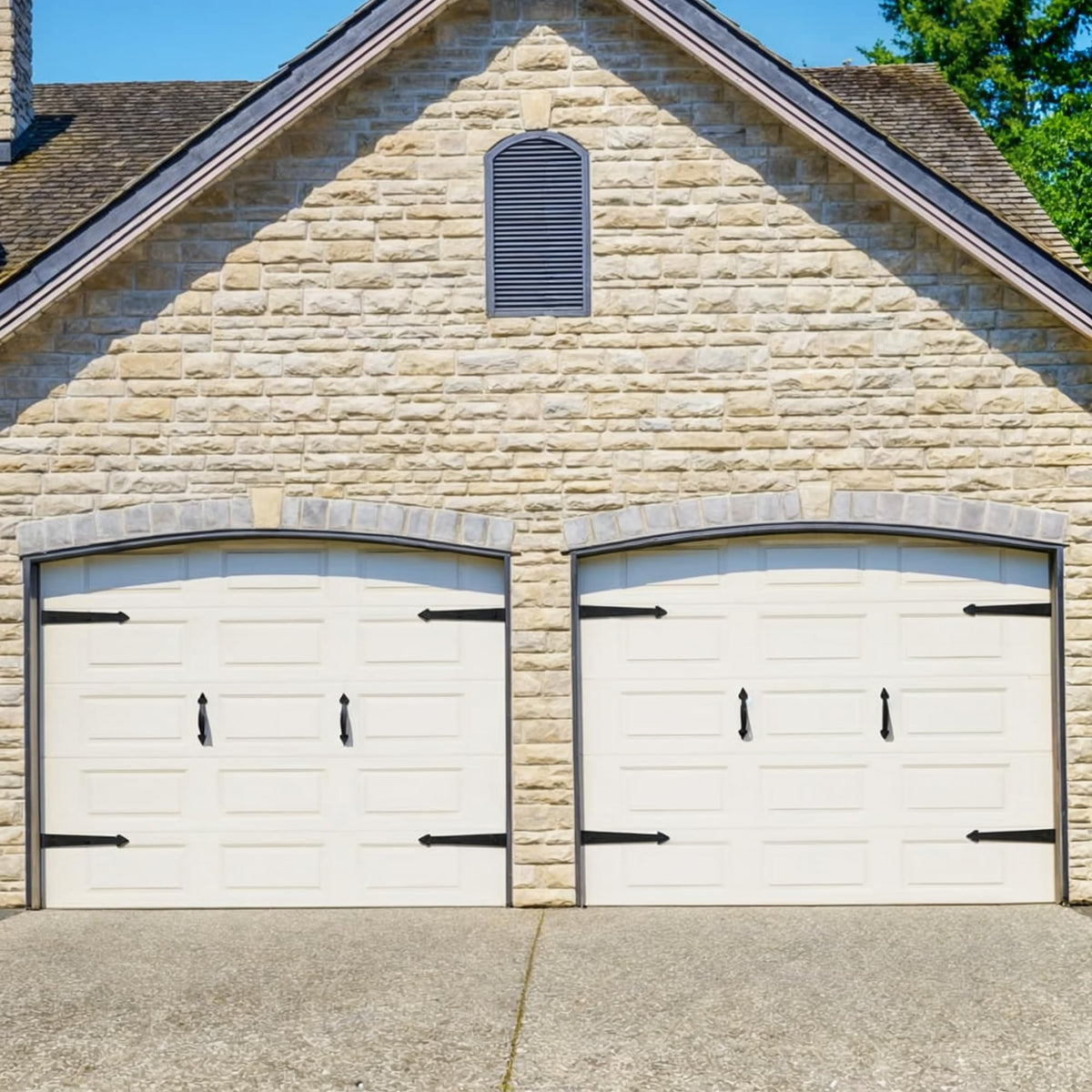 SANKEYTEW decorative handles on a black garage door offer stylish detail.