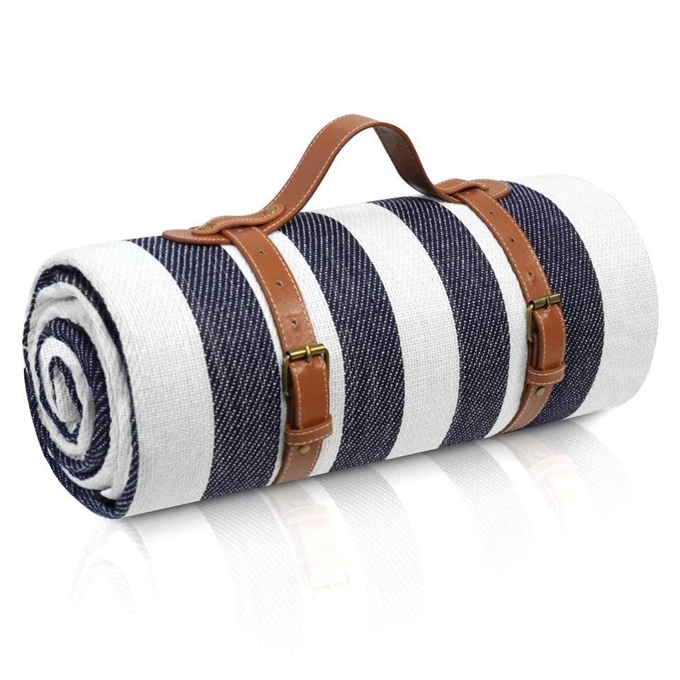 Sapsisel picnic blanket rolled with belt for easy transport.