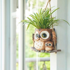 Saysmile Swing Owl planter showing large drainage hole for easy watering