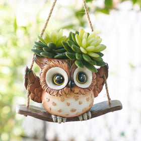 Saysmile swing owl planter adds whimsy while supporting small indoor plants.