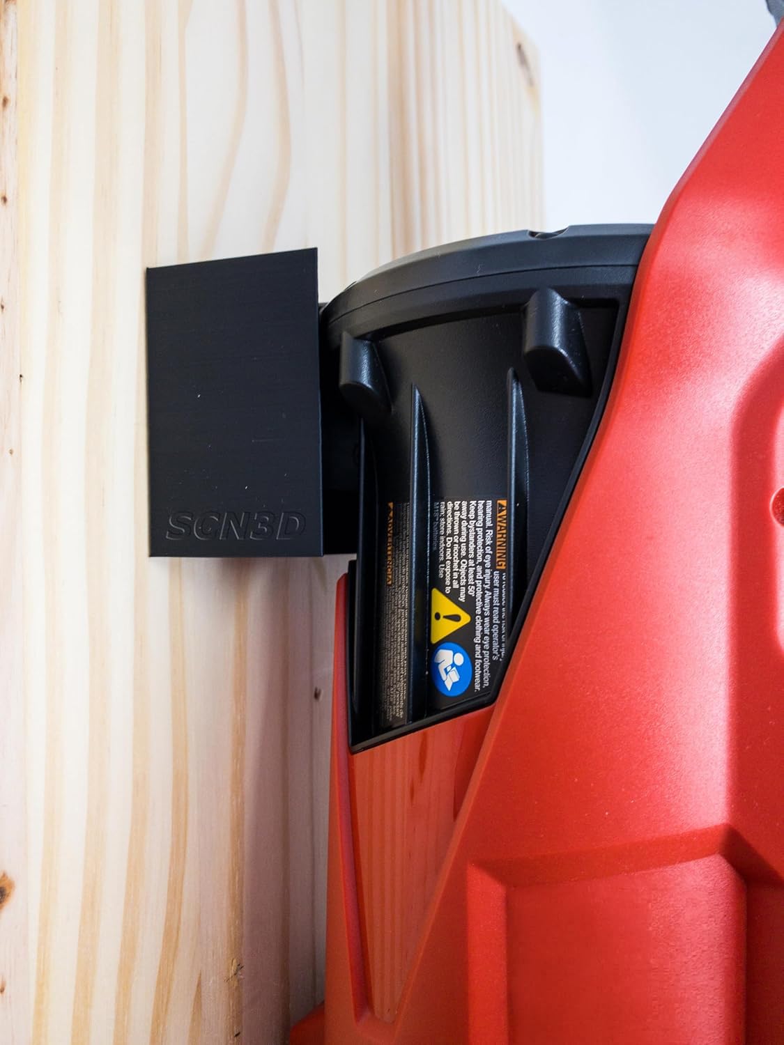 Close-up of SCN3D Milwaukee M18 Fuel wall mount red finish