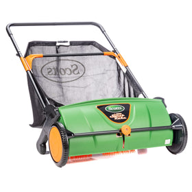 Scotts LSW70026S sweeper front view collecting dry leaves on a lawn for quick cleanup.