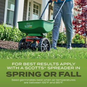 Scotts Turf Builder lawn fertilizer application promotes healthy green growth.