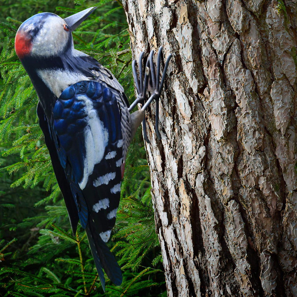 Shefio metal woodpecker figurine perched in garden adds seasonal charm
