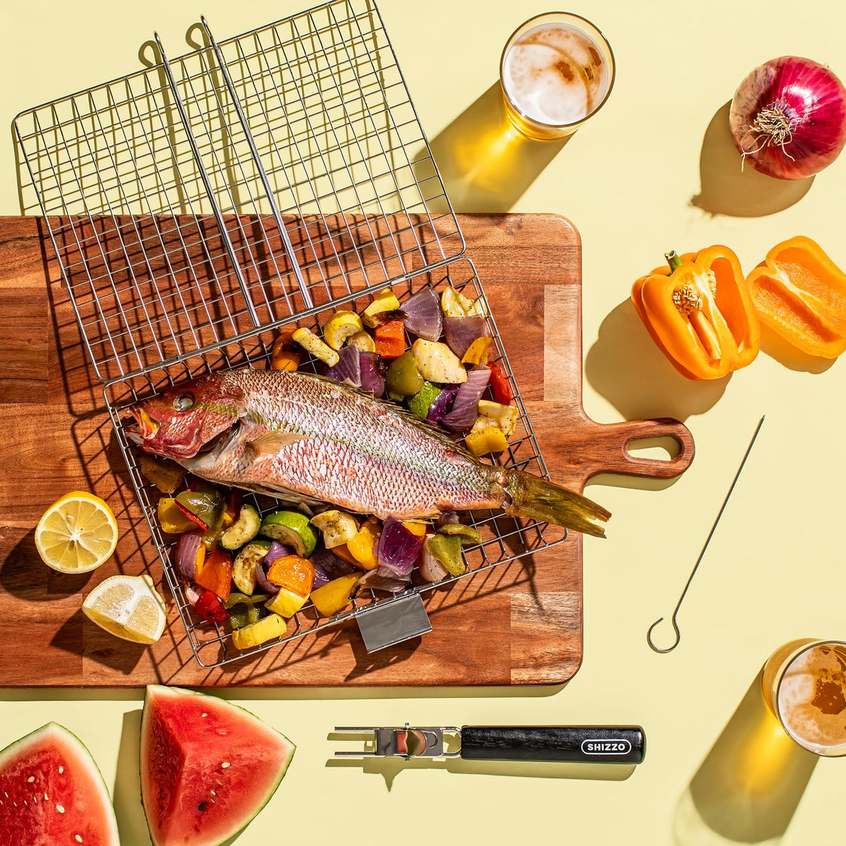 SHIZZO grill variety foods shows capacity for meats, seafood, veggies.