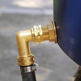 Brass elbow installed outdoors shows durability in varying weather conditions.